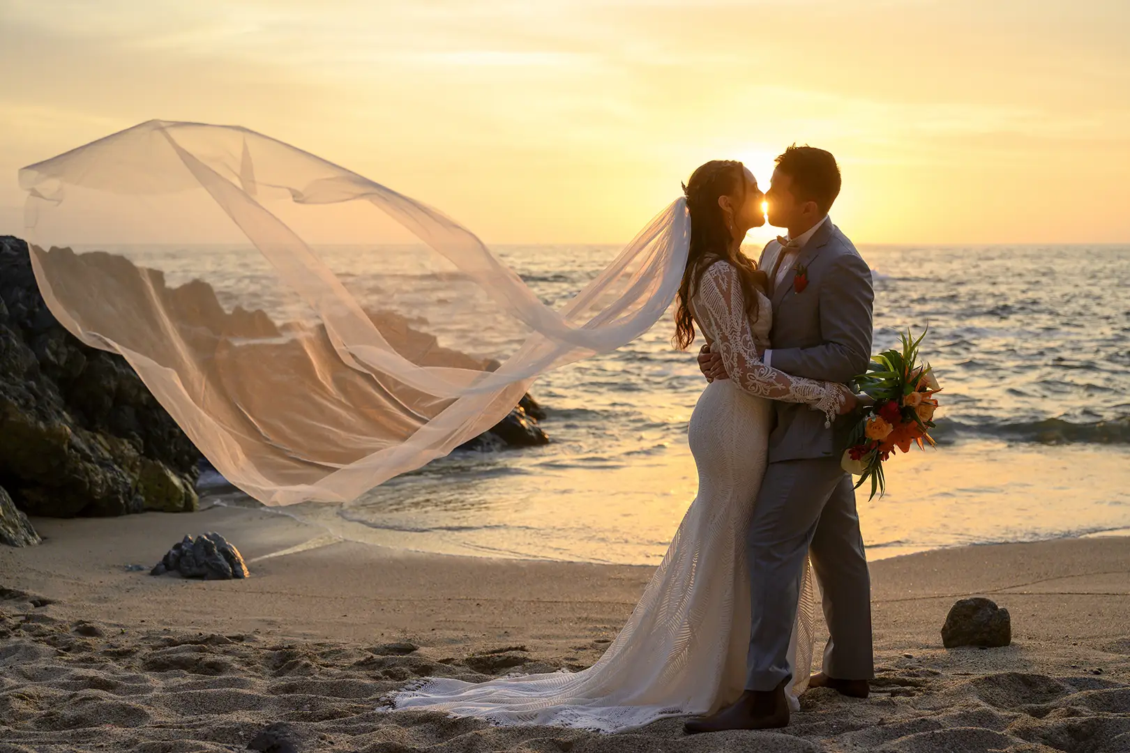 Couple on the beach at sunset