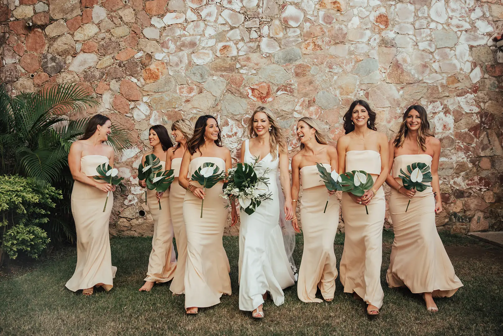 Bridal party at the stone wall